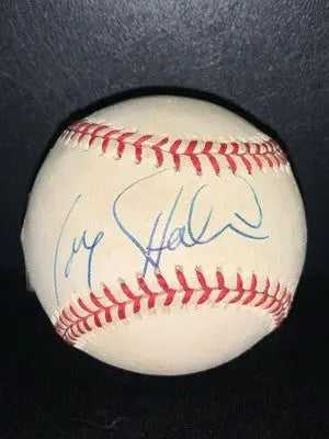 Autographed single signed Larry Holmes baseball with red stitching and blue autograph