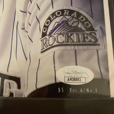 Colorado Rockies baseball program cover featuring Larry Walker from 1998 NL MVP
