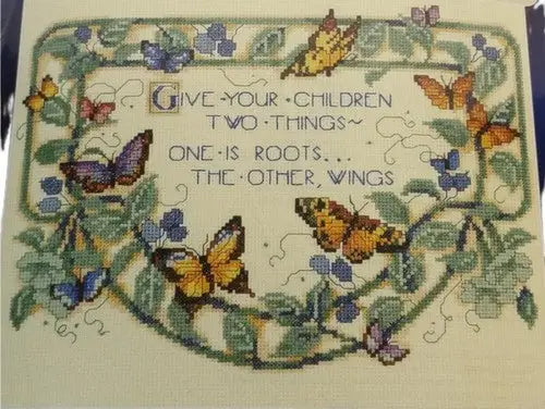 Embroidered tapestry featuring butterflies foliage and quote from Leisure Arts Designs
