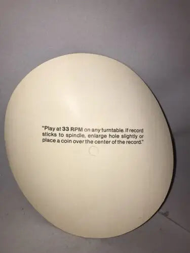 Egg-shaped record with playing instructions for Stars Super Bowl XXI Bert Jones