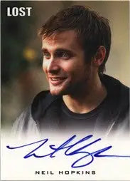 Autographed Neil Hopkins trading card featuring a smiling young man with dark hair
