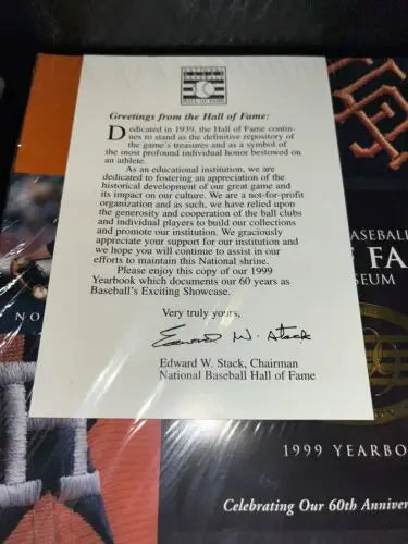 Baseball Hall of Fame 1999 Yearbook with letter showcasing Robin Yount and Nolan Ryan trading cards