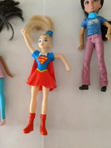 Supergirl doll with red boots from McDonald’s toys pre-owned lot on store shelf pulls