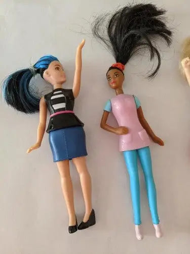 Two fashion dolls from a pre-owned lot of McDonald’s toys store shelf pulls