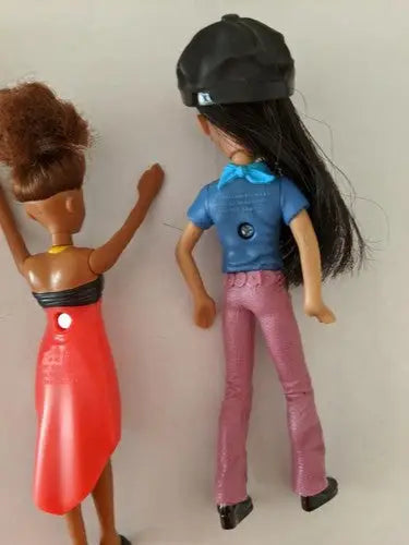 Pre-owned lot of McDonald’s toys featuring two plastic dolls from store shelf pulls