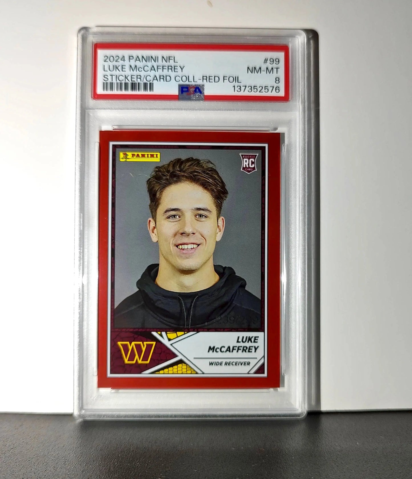 Luke McCaffrey 2024 Panini Sticker Collection 239/299 #99 Rookie Red Foil PSA 8 - Football Card Single