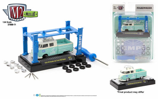 Mint green and white Volkswagen Double Cab Truck model kit on blue lift with tools