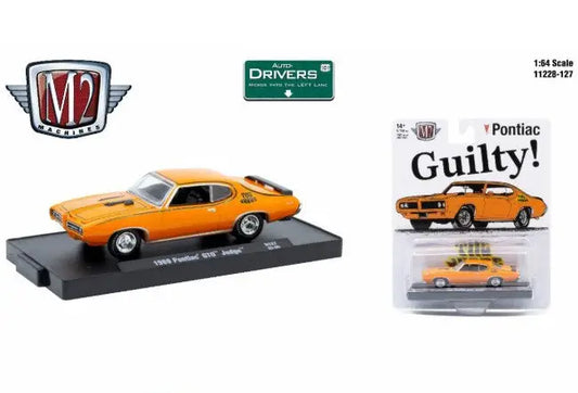 Orange 1969 Pontiac GTO Judge die-cast model on display and in blister packaging from M2 Machines Auto-Drivers