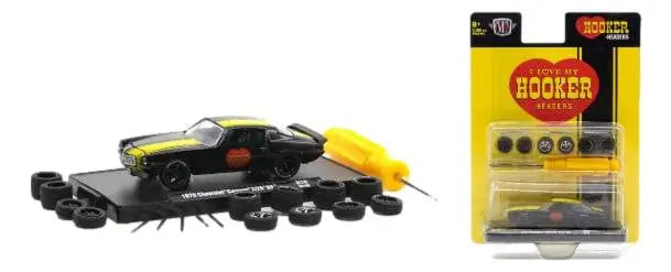 Model car kit of a black and yellow Chevrolet Camaro with customizable parts and accessories