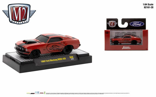 Red 1969 Ford Mustang BOSS 429 die-cast model in M2 Machines Ground Pounder packaging