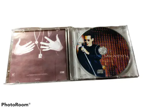 Open Marc Anthony CD album with original gloss from Columbia Col featuring his image and booklet