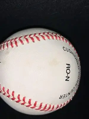 White baseball with red stitching and dirt mark, Mark McGwire signed official National League ball