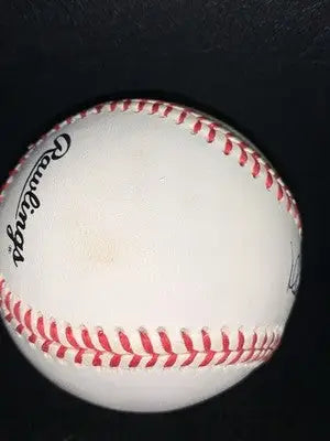 White baseball with red stitching from Mark McGwire Signed Official National League Ball