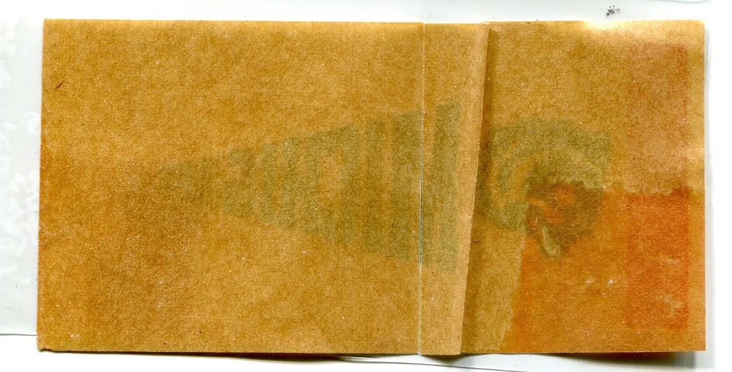 Old, stained, and folded paper with Michigan Wolverines pennant sticker decal design