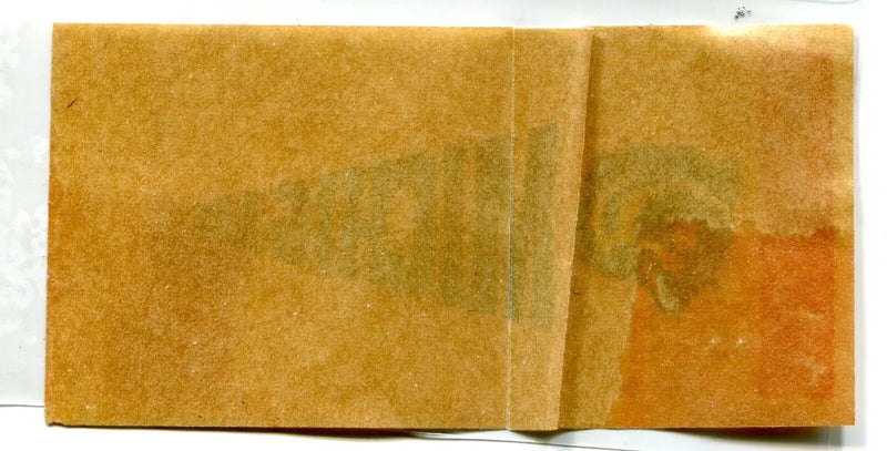 Old, stained, and folded paper with Michigan Wolverines pennant sticker decal design