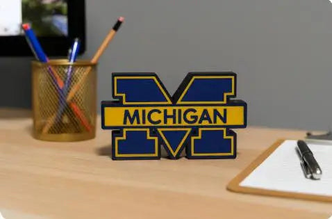 Blue and yellow Michigan Wolverines desk ornament in PLA plastic wall display