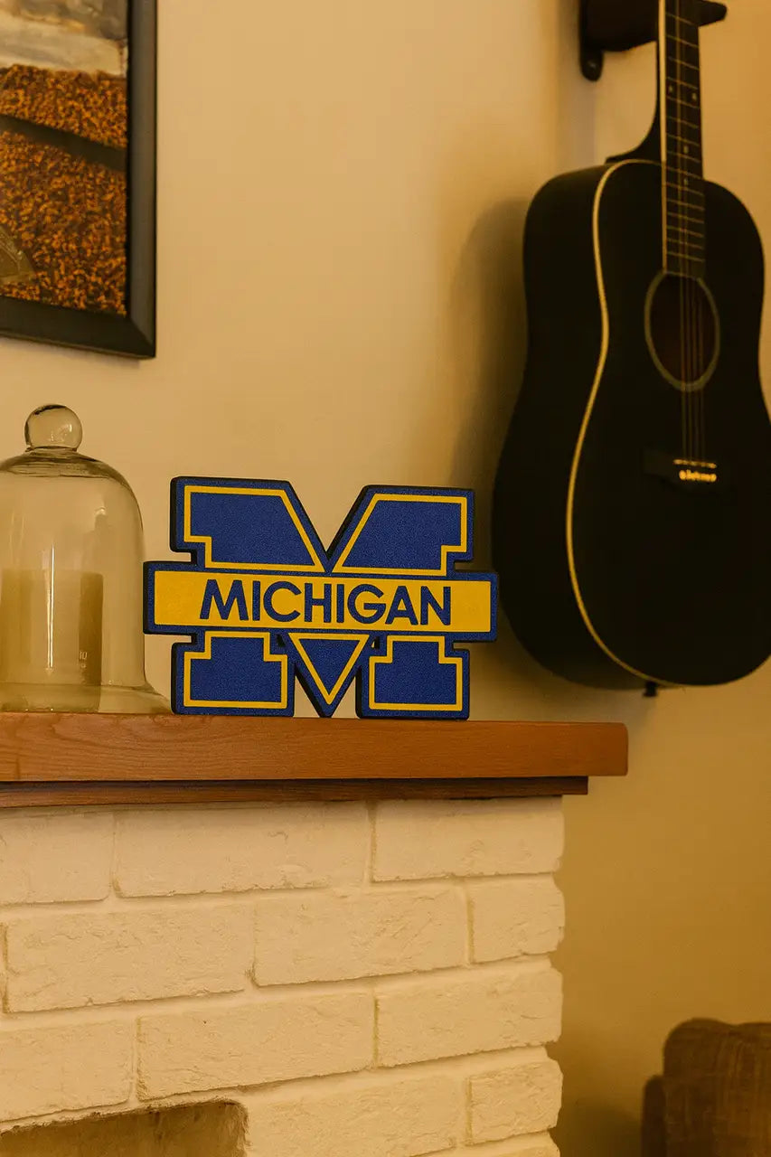 Blue and yellow Michigan Wolverines logo wall display made from PLA plastic for desk decor