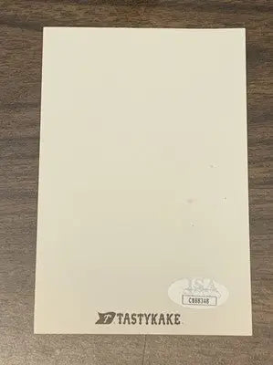 Cream-colored rectangular card featuring Mike Schmidt autograph from the Philadelphia Phillies