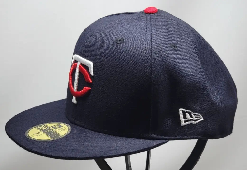 Navy Minnesota Twins MLB New Era 59FIFTY fitted on-field cap with red and white logo