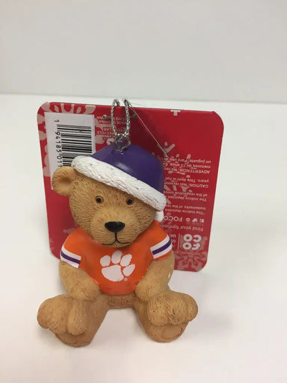 Plush NCAA Team Jersey Bear Ornament in purple hat and orange shirt with paw print logo
