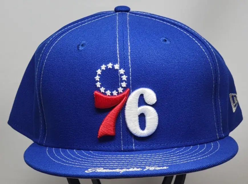 Blue Philadelphia 76ers fitted hat featuring side script and 5950 59FIFTY design