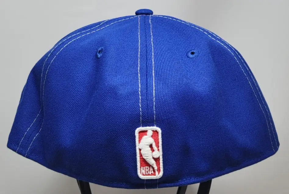 Blue New Era fitted hat with NBA logo for Philadelphia 76ers fans