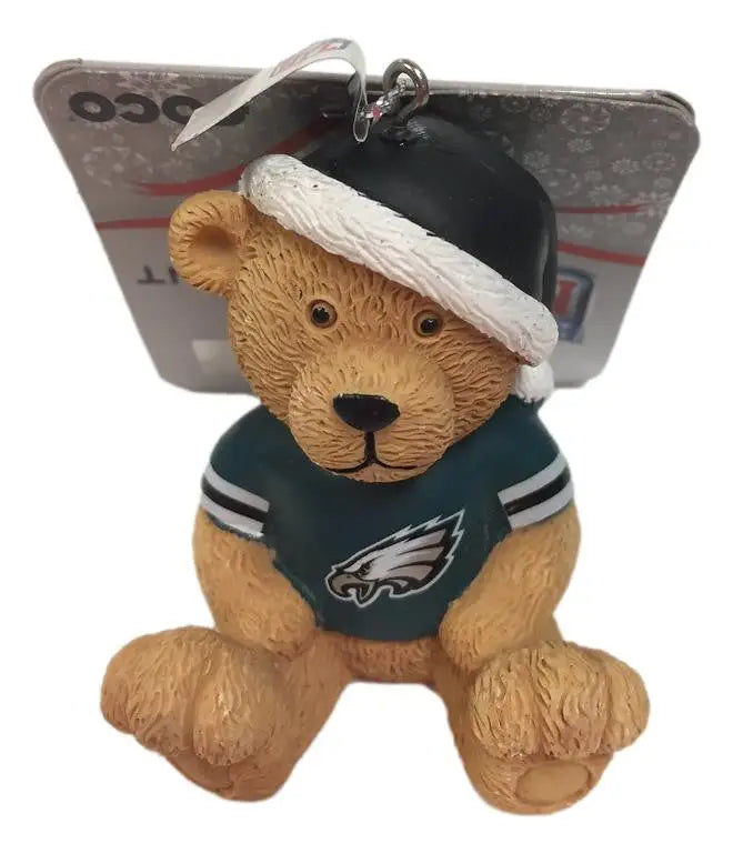 Teddy bear ornament wearing Philadelphia Eagles jersey and white hat for fans