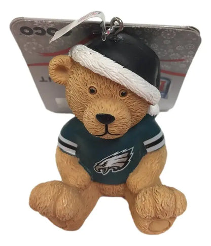 Teddy bear ornament wearing Philadelphia Eagles jersey and white hat for fans