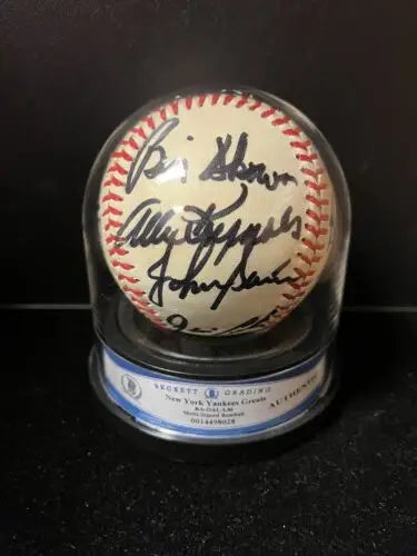 Autographed NY Yankees Greats signed baseball in display case featuring 16 signatures