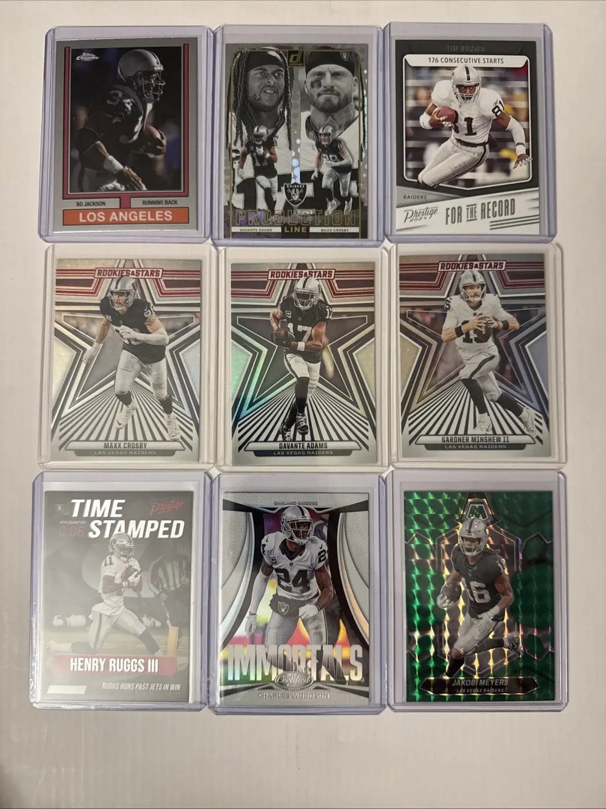Collection of nine Oakland Las Vegas Raiders football trading cards featuring rookies and parallels