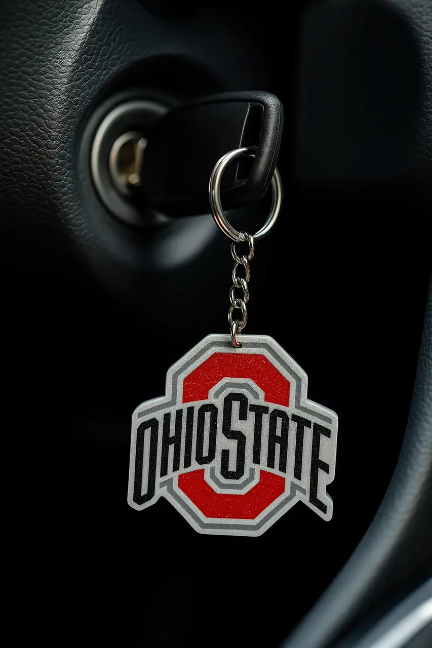 Ohio State Buckeyes logo keychain attached to car key, perfect fan gift or stocking stuffer