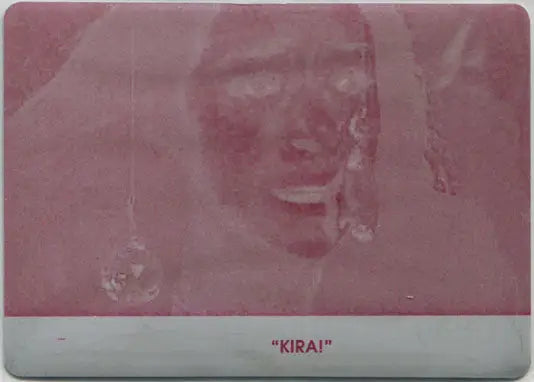 Faded reddish image of a face on Orphan Black Season 1 Printing Plate Base Card 71 Magenta