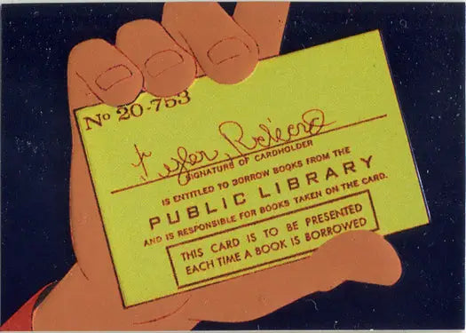 Yellow Pagemaster Embossed Foil Chase Card F9 Library Card held by a hand