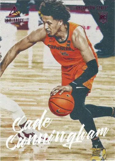 Basketball player in orange jersey dribbling ball on court for Pink Parallel Card
