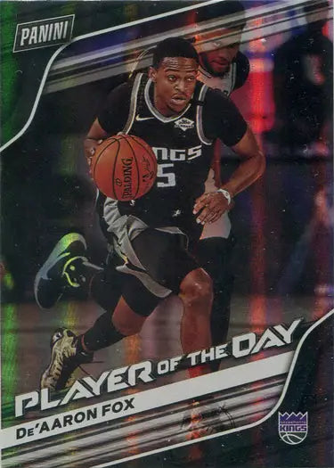 Basketball trading card featuring De’Aaron Fox dribbling in a black jersey, parallel base card