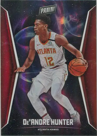 Basketball trading card of De’Andre Hunter dribbling in white Atlanta Hawks uniform, parallel base card