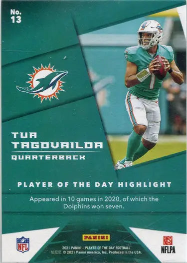 Football player in Miami Dolphins uniform holding football, featuring Tua Tagovailoa base card