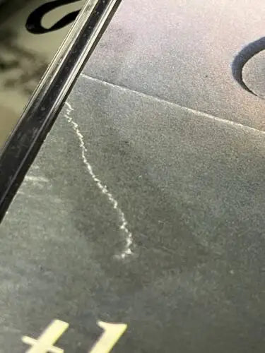Scratched dark surface beneath Paul Konerko Autographed Signed AUTO 1997 Baseball cover