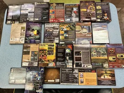 Collection of PC game boxes including Medieval LOTR WOW Starfleet Command Dawn War galactic civilizations
