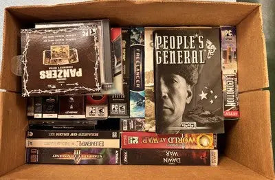 Box of PC games featuring Medieval LOTR WOW Starfleet Command Dawn War and more