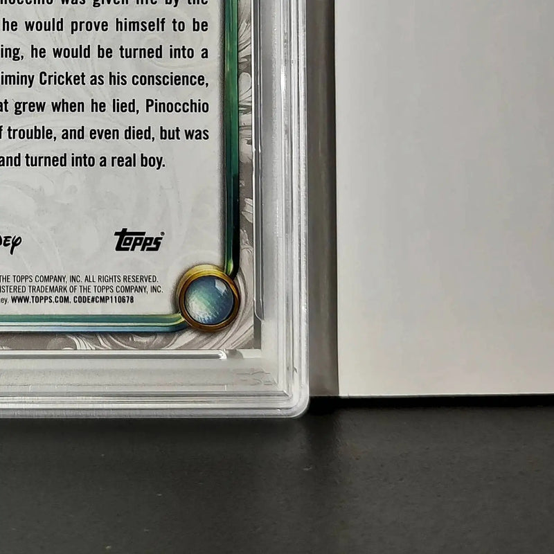 Pinocchio 2025 Topps Disney Wonder #7 Winter Variant Card Pinocchio PSA 8