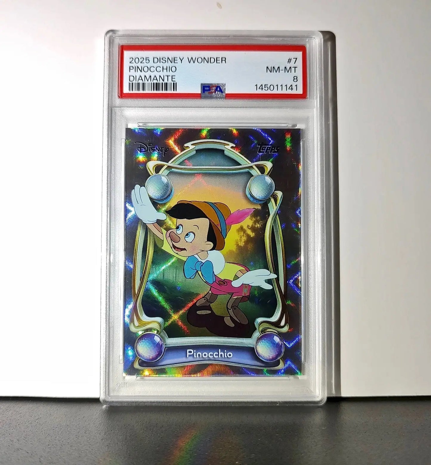 Pinocchio 2025 Topps Disney Wonder #7 Winter Variant Card Pinocchio PSA 8