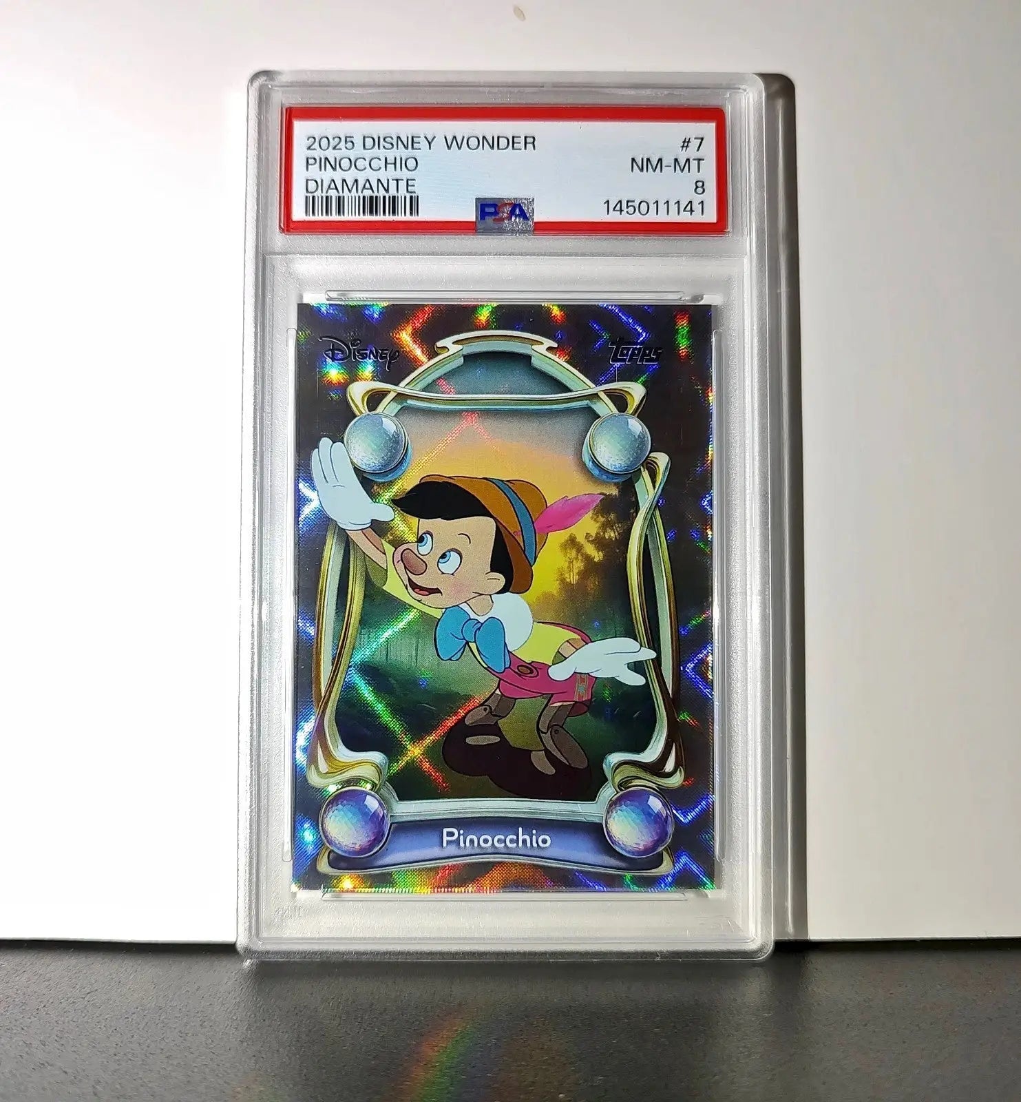 Pinocchio 2025 Topps Disney Wonder #7 Winter Variant Card Pinocchio PSA 8