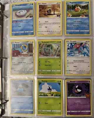 Pokémon card binder collection with a sheet displaying nine Pokémon cards inside a binder
