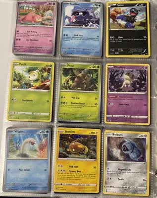 Pokémon card binder collection with nine protected trading cards in sleeves