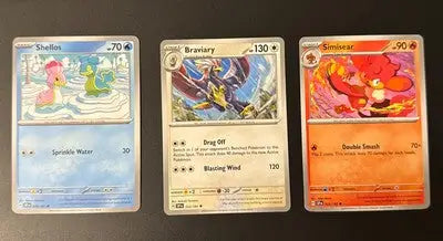 Pokemon Surging Sparks trading cards lot featuring three collectible cards for fans