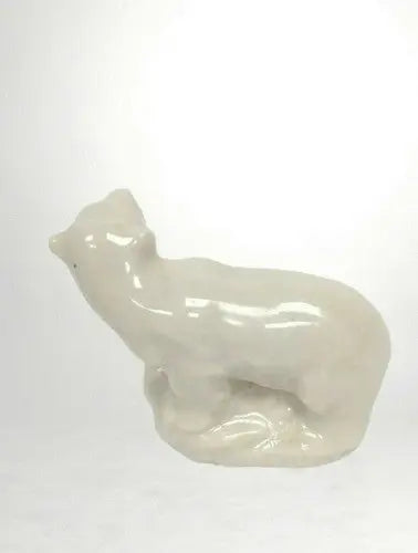 White ceramic polar bear figurine from Polar Bear Wade England on store shelf pulls