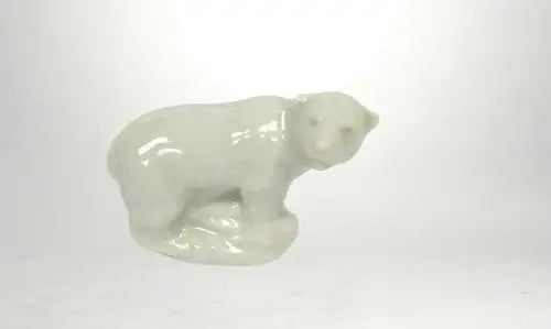 White porcelain polar bear figurine from Polar Bear Wade England on store shelf pulls