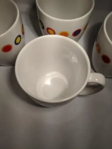 White ceramic 12oz mugs with colorful polka dots from Rare Contemporary Corelle set