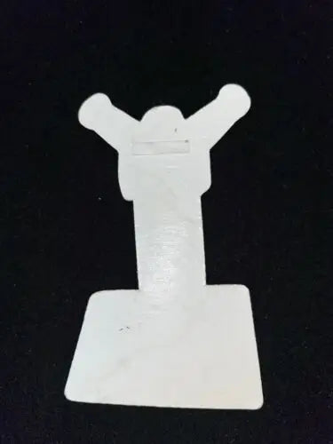 White plastic tile leveling clip for Robin Williams Jack movie tag badge promotion